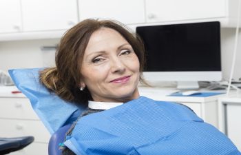 Woman Sitting in a Dentist Chair