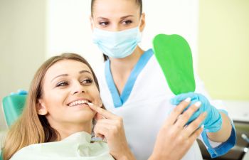 Smiling Patient in Dental Chair After Chipped Tooth Repair Marietta GA